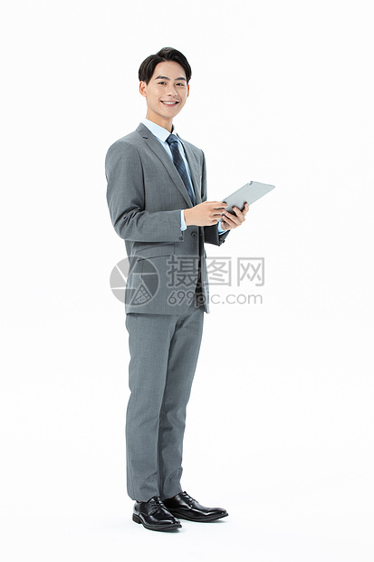 商务男性拿着平板电脑图片
