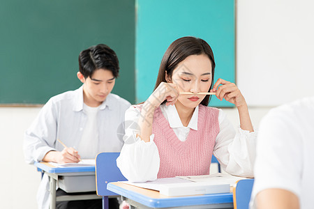 做笔记的女孩青年男女考研考试背景