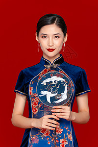 中国风旗袍美女拿扇子背景