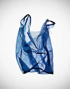 桌子上皱巴巴的蓝色塑料袋高清图片