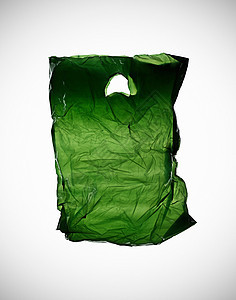 桌子上皱巴巴的绿色塑料袋图片