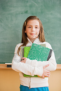 女学生拿课本智力高清图片素材