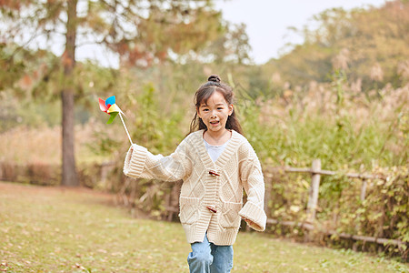 玩风车的小女孩小女孩玩风车背景