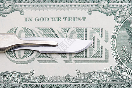 手术刀和一美元钞票图片