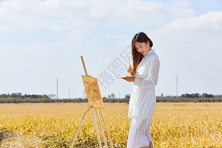 文艺清新美女户外油画写生图片