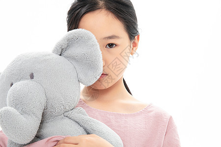 难过的女孩抱着玩具小象模特高清图片素材