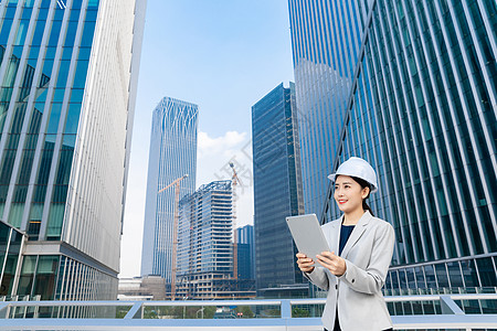 女性建筑工程师美女拿平板电脑背景