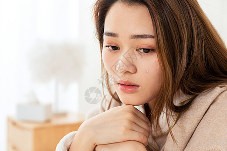 难过,悲伤女性流泪局部特写背景