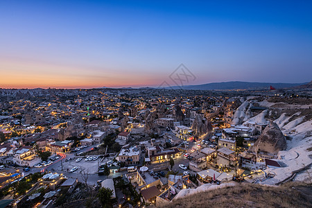 喀斯特地貌土耳其帕多西亚格雷梅村日落夜景背景