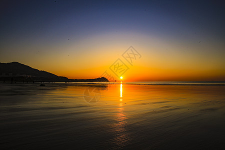 青岛石老人海水浴场海上日出中国十大最美日出观赏地背景