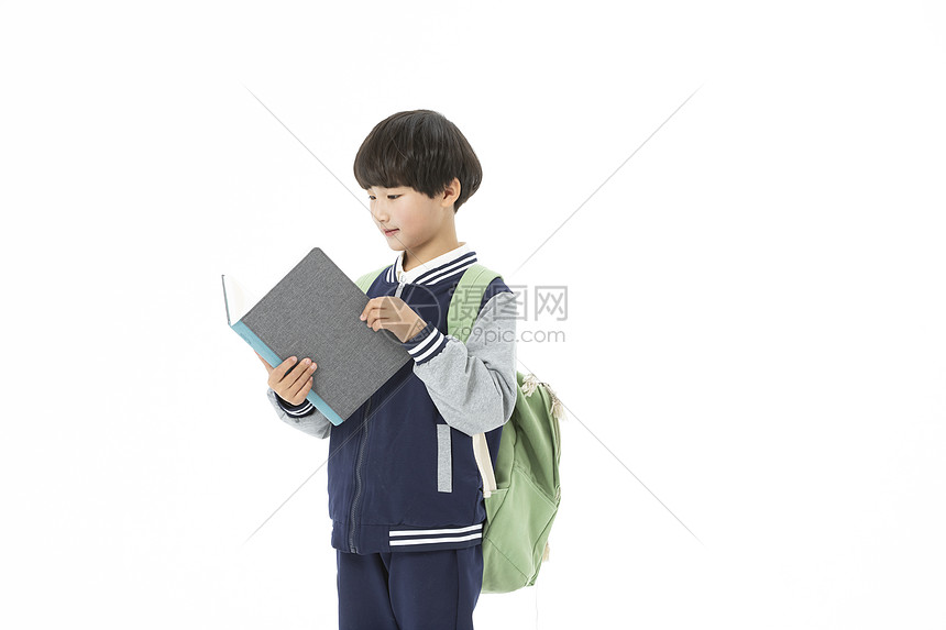 青少年开学背着书包点拿着书本图片