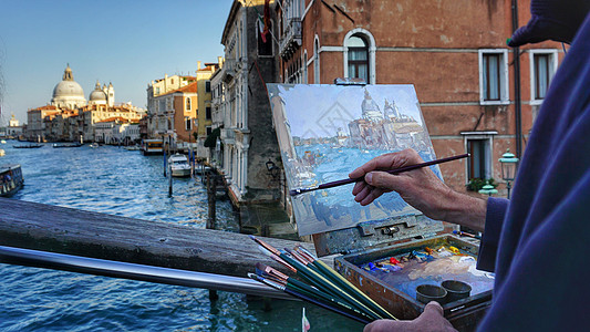 意大利街头街头画家威尼斯大运河夕阳背景