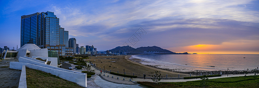 青岛石老人海水浴场日出时全景背景