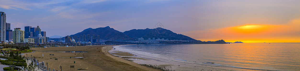 青岛石老人海水浴场日出时全景背景