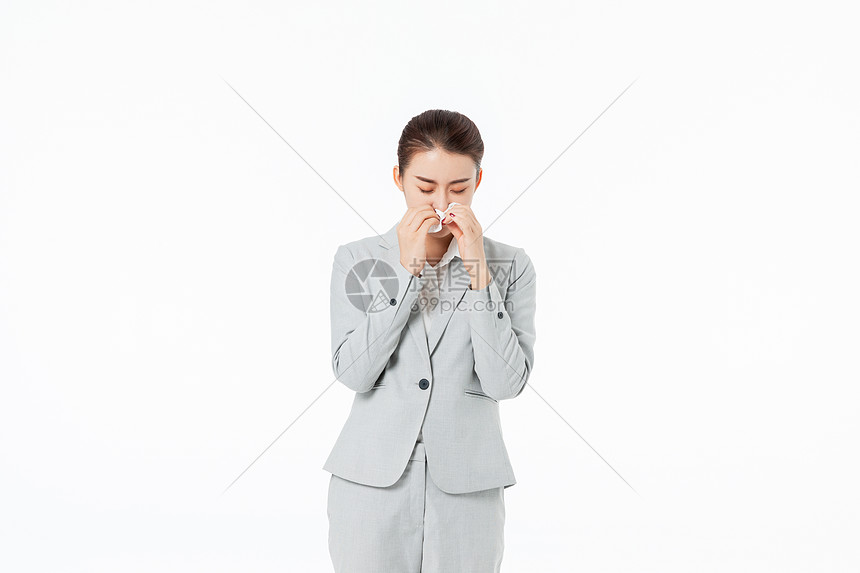青年商务女性感冒擦鼻涕图片