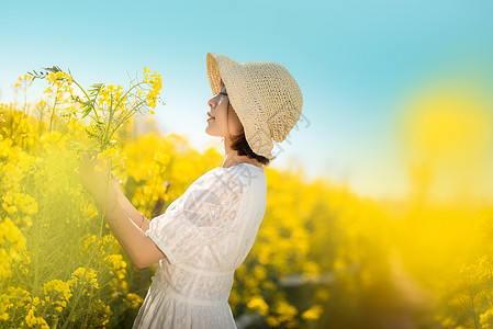 航拍花海唯美油菜花春游白裙美女背景