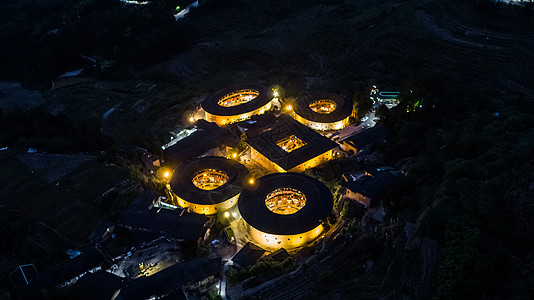 永定楼夜景中国福建靖南土楼夜景四菜一汤背景