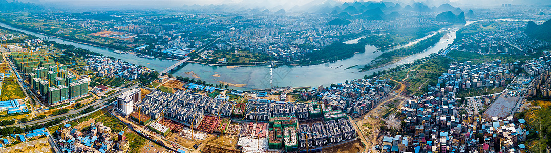 全景图航拍桂林漓江山脉江边开发楼盘经济发展背景图片