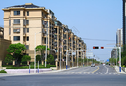 路城市城市小区楼盘和道路口的红绿灯背景