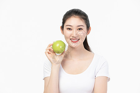 女性健康饮食拿青苹果图片