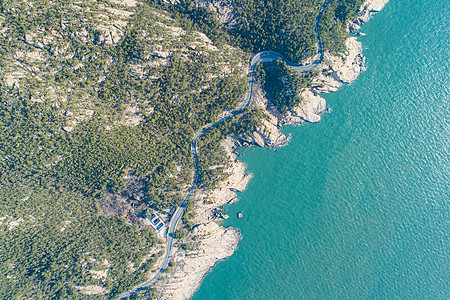 海边公路航拍青岛崂山5A级国家风景名胜区背景