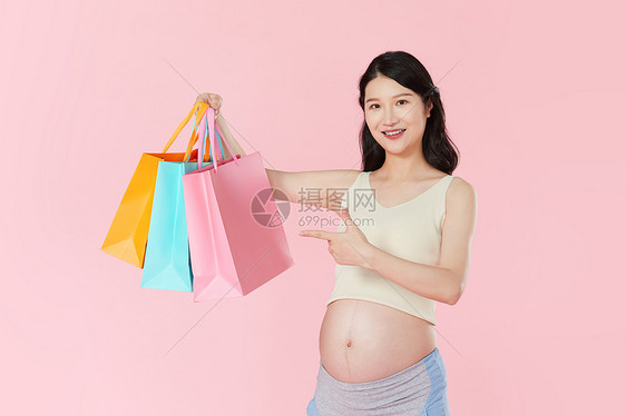 孕妇手拿购物袋图片
