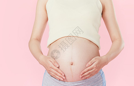孕妇手扶肚子图片