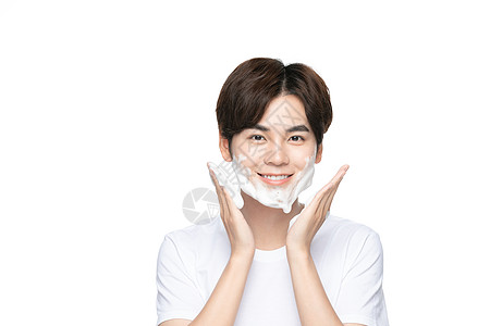 洗脸的人男性用洗面奶清洁洗脸背景