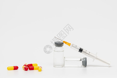 医疗健康用品注射针管与疫苗药物背景图片
