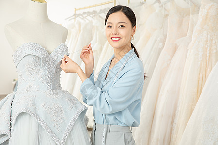 服装缝制服装设计师缝制婚纱背景