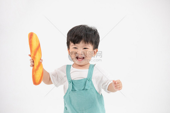 可爱小宝宝拿着面包跑动玩耍图片