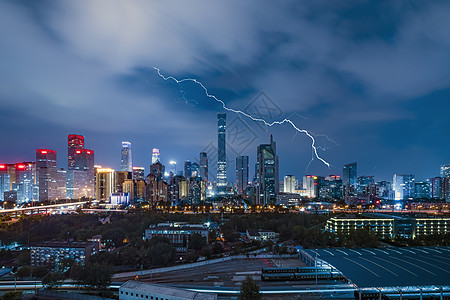 下雨夜景闪电北京国贸中心背景