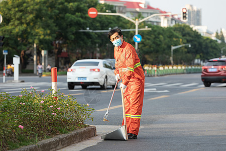 隐形车衣户外打扫城市街道的环卫工人背景