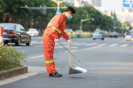 户外打扫城市街道的环卫工人背景图片