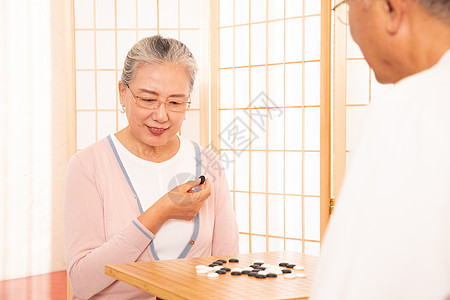 老年夫妇下围棋中国风高清图片素材