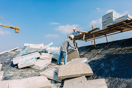 防水施工屋顶建筑工地正在施工的建筑工人背景