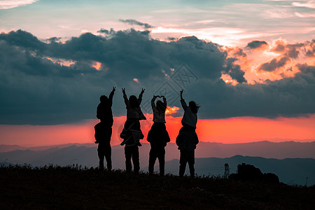 夕阳情侣人像剪影摄影图片高清图片