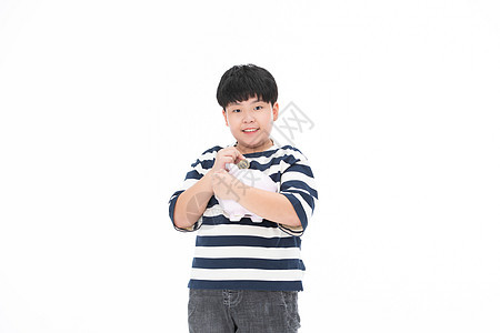 抱着小猪存钱罐的小男孩小胖子图片