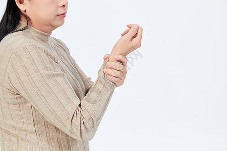 手部酸痛的中年女性图片