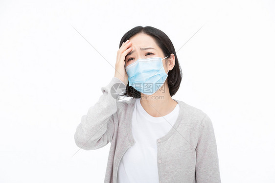 戴口罩女性疾病身体不舒服头疼图片