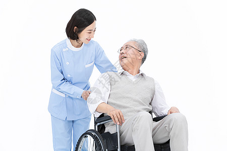 老人护理护士推着轮椅带老人散步背景