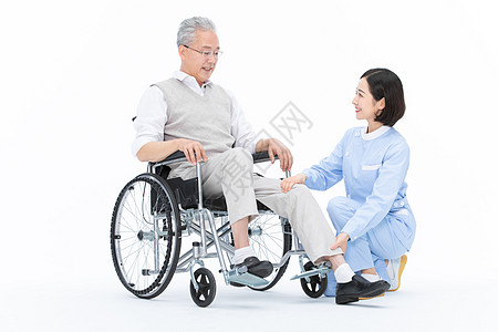 老年护理护士照顾老人帮老人捏腿背景