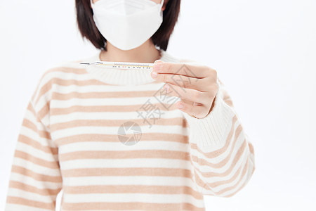 生病使用水银温度计体温计测量体温的女性背景图片