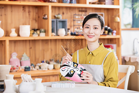 中国脸谱美女匠人绘制脸谱背景