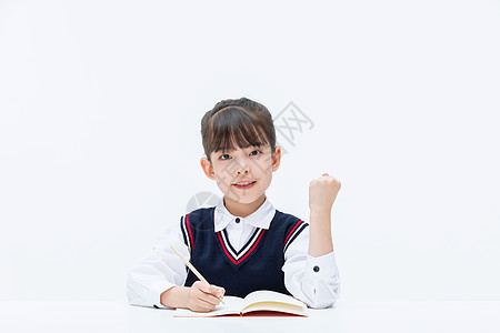 男孩写作业小女孩在课桌前学习做作业背景