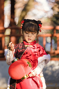 中国风唐装可爱小女孩新年公园游玩背景图片