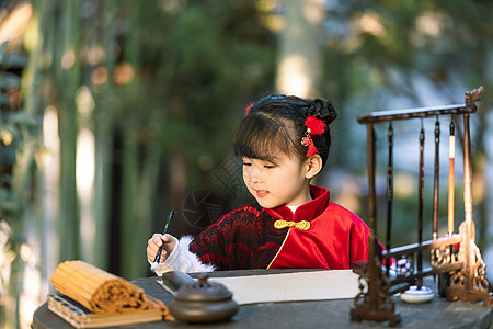 中国风小女孩公园里写书法毛笔字背景图片