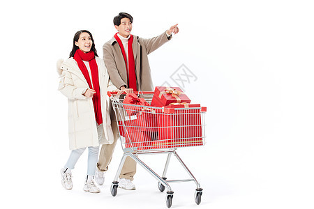 青年夫妻推购物车买年货过新年背景图片