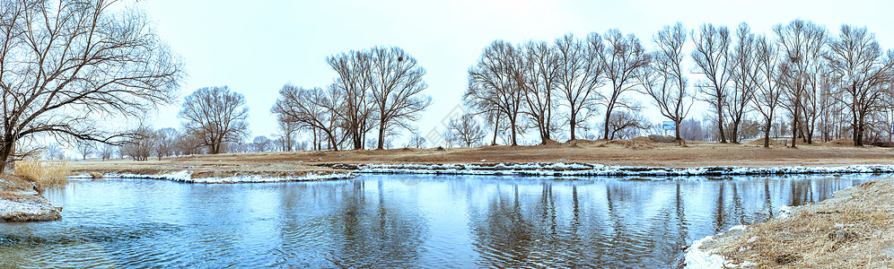 萧条内蒙古冬季山村河水树木外景背景