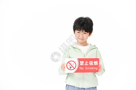 手拿禁烟牌子的小男孩背景图片